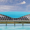 Modern Bridge With Blue Curved Roof And Grid Structure Over Water Green Grass Sky