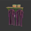 Dark Colored Clothes With Brown Decorations Hanging On Wooden Shelf With Baskets