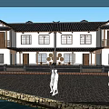 Traditional Chinese Boutique Guesthouse With White Walls Black Tiled Roof And Stone Paved Courtyard