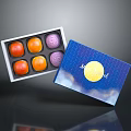 Six Colorful Round Mid-Autumn Mooncakes in Open Blue Gift Box with Moon Cloud Patterns