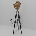 Modern Floor Lamp With Metallic Shade And Black Tripod Stand Design