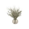 Delicate White Small Flowers with Green Branches in Transparent Glass Vase