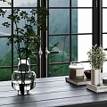 Green Foliage In Glass And White Vases On Wooden Tabletop By Window With Mountain View