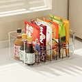 Transparent Kitchen Storage Organizer Holding Condiment Bottles And Snack Packs On Countertop