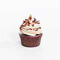 Delicious Cupcake With Creamy Frosting And Chocolate Shavings In Brown Liner