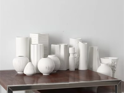 White Ceramic Vessels in Various Shapes Displayed on Wooden Table with White Wall Background 3d model