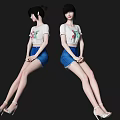 Woman Sitting On Floor With White T-shirt Blue Shorts And High Heels Black Background