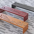Modern Landscape Seats with Perforated Design in Vibrant Orange Red and Black on Striped Floor