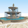 Classical Multi Tiered Fountain With Flowing Water And Paved Surrounding Area