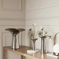 Modern Silver Vases With White Flowers In Interior Decor On Wooden Shelf