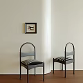 Stylish Single Chairs With Curved Backrest Black Frame And Striped Seats Against Light Wall