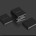 Black Cover Book of Art Books Stacked and Laid Flat on Blue Surface