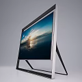 Modern Television With Black Frame Stand Showing Sunset Seaview Cloudy Sky And Sunlight Reflection