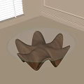 Modern Minimalist Coffee Table With Glass Top And Irregular Wooden Base In Bright Room