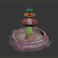 Ornate Multi Tiered Fountain With Red Gold Accents And Circular Stone Base