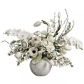 Elegant White Vase with White Orchids Tulips Ranunculus and Fresh Green Foliage