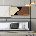 Blue Bed with White Gray Pillows Yellow Blanket Green Cabinet Decorative Paintings and Golden Light
