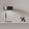Modern Table Lamp With Round Shade Metal Base And Geometric Decor On White Shelf
