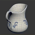 White Ceramic Pitcher With Blue Floral Patterns And Curved Handle