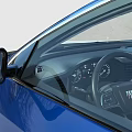 Blue Modern Sedan Car With Stylish Front Grille And Sleek Headlights