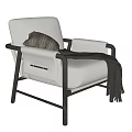 Beige Fabric Accent Chair With Dark Wooden Armrests And Gray Throw Blanket