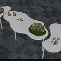 Modern Tea Break Area Featuring Curved White Tables Green Plants And Snacks