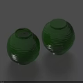 Pair Of Green Ceramic Vases With Wavy Textures On Blue Background