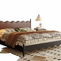 Stylish Double Bed with Scalloped Headboard Nightstand Table Lamp and Floral Bedding on Patterned Rug