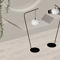 Stylish Modern Floor Lamps With Black Stands And White Globe Shades In Interior Space