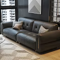 Black Leather Multi person Sofa With Geometric Pattern Pillows Glass Coffee Table And Area Rug
