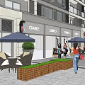 Modern Building Outdoor Shopping Area With Storefronts Seating Umbrellas Green Planters And Pedestrians