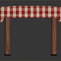 Dining Table with Red and White Checkered Tablecloth and Wooden Legs