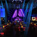Modern Bar Interior Design With Red Leather Seats Bar Counter And Lighting Decor