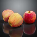 Three Fresh Apples With Red And Yellow Gradient On Black Reflective Surface