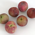 Six Fresh Red and Green Peaches Arranged on Clean White Background Surface