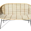 Modern Rattan Outdoor Chair With Curved Design And Black Metal Legs