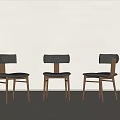 Three Modern Black Dining Chairs With Wooden Legs And Leather Seats