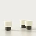 Three Elegant Plush Stools with Dark Cylindrical Legs Against Light Background