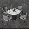 Modern Round Dining Table With White Marble Top And Light Gray Upholstered Chairs
