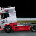 Sleek Volvo VNL Truck With Red Silver Exterior Moving On Road At Night