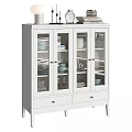 White Sideboard With Glass Doors Displaying Dinnerware Glasses Top Decorative Books And Items