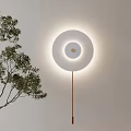 Modern Round White Wall Light Illuminated With Green Plant For Interior Decoration