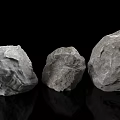 Three Natural Stone Decorative Pieces with Wood Accent and Rough Surface Texture