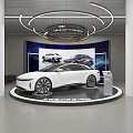 Car Dealership Showroom Showcasing White Car With Modern Lighting And Display Screen