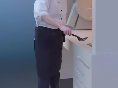 A Man In Black Apron Cooking With Spatula At Modern Kitchen Counter 3d model