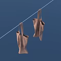 Two Brown Soft Bags Hanging On A String Against Blue Background 3d model