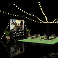 Outdoor Cinema With Yellow String Lights Large Movie Screen Green Carpet Foldable Chairs Potted Plants