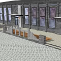 Modern Building Exterior With Gray Brick Walls Large Windows Stone Paved Ground And Bench Seating