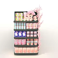 Retail Product Display On Multi Layered Shelf With Pink Cherry Blossom Decorations Pastel Colored Packages