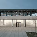 Modern Exhibition Hall Interior Design With Grid Ceiling Glass Windows Wooden Walls And Staircase